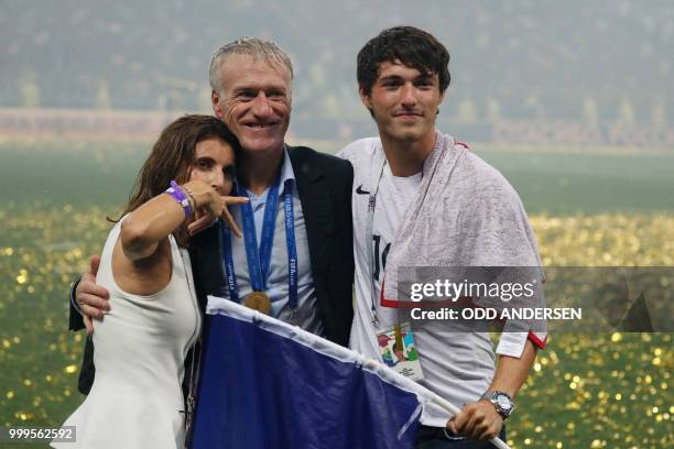 France's coach Didier Deschamps celebrates with his wife Claude and son Dylan after the Russia 2018 World Cup final football match between France and...