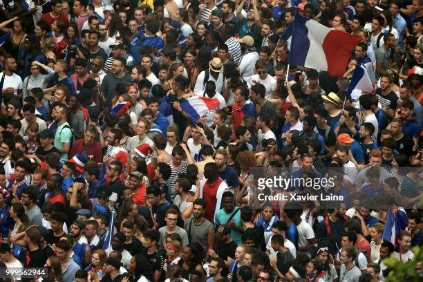Fans celebrate after France’s victory against Croatia in the 2018 FIFA World Cup final at Champs Elysee on July 15, 2018 in Paris, France.