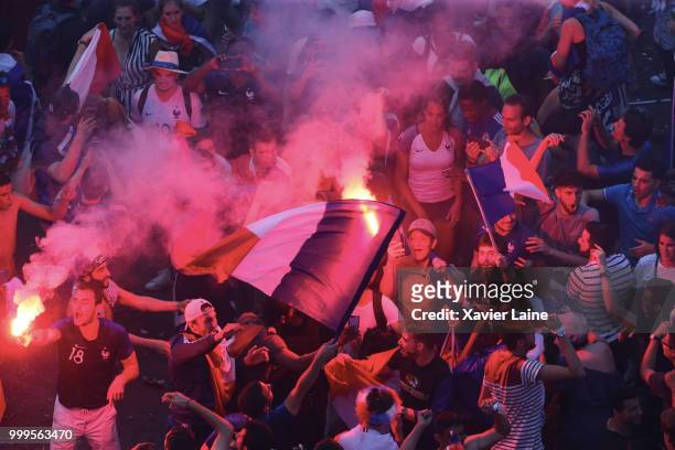 Fans celebrate after France’s victory against Croatia in the 2018 FIFA World Cup final at Champs Elysee on July 15, 2018 in Paris, France.