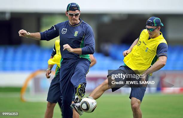 South African cricket team captain Graeme Smith plays a game of soccer with teamamtes during a practice session at Sir Vivian Richards Stadium in St...