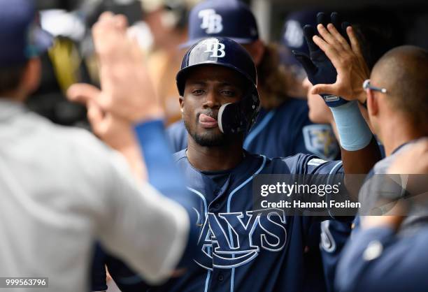 Adeiny Hechavarria of the Tampa Bay Rays celebrates scoring a run against the Minnesota Twins during the second inning of the game on July 15, 2018...