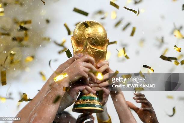 France's players lift the Fifa World Cup trophy after the Russia 2018 World Cup final football match between France and Croatia at the Luzhniki...