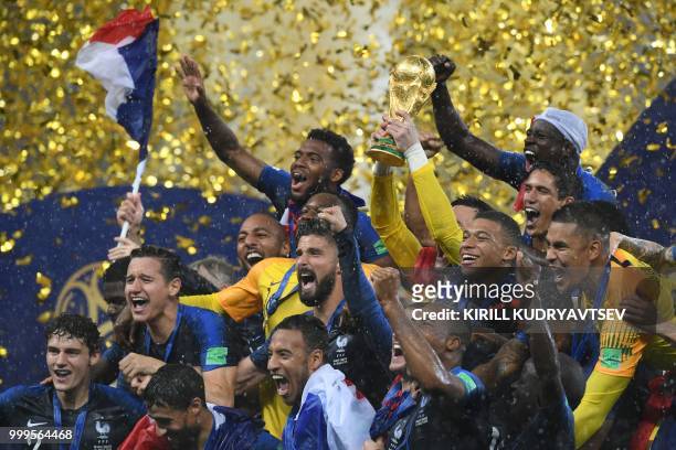 French players celebrate with the trophy at the end of the Russia 2018 World Cup final football match between France and Croatia at the Luzhniki...