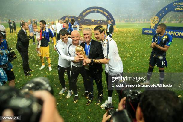 France coach Didier Deschamps poses with the trophy after the 2018 FIFA World Cup Russia Final between France and Croatia at the Luzhniki Stadium on...