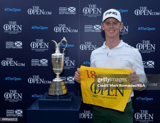 Brandon Stone of Republic of South Africa poses with the Claret Jug after qualifying for the Open by winning the Scottish Open during the Open...