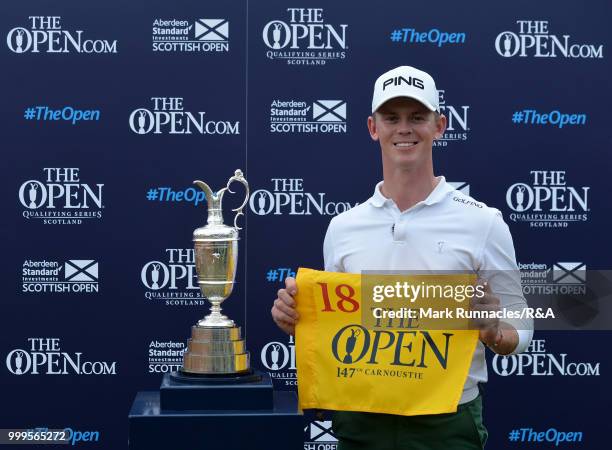 Brandon Stone of Republic of South Africa poses with the Claret Jug after qualifying for the Open by winning the Scottish Open during the Open...