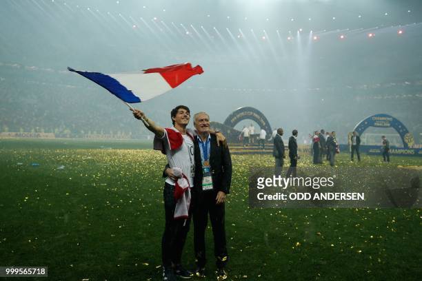 France's coach Didier Deschamps celebrates with his son Dylan after the Russia 2018 World Cup final football match between France and Croatia at the...