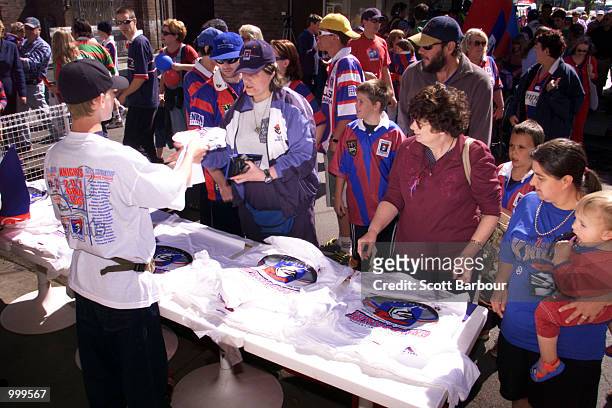 Fans line up to buy Grand Final edition T-Shirts during the Newcastle Knights Fan Day in preparation for the NRL Grand Final against the Parramatta...
