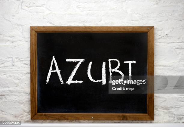 chalkboard with the word --azubi--, german for apprentice - azubi stock pictures, royalty-free photos & images