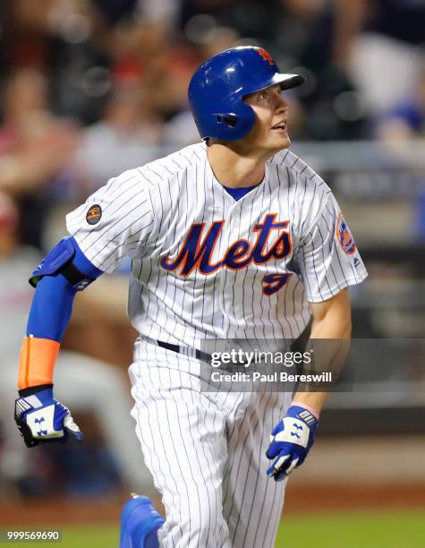 Brandon Nimmo of the New York Mets celebrates as he runs up the first base line after hitting a game winning walk off home run in the 10th inning in...