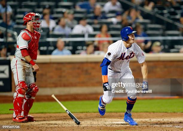 Brandon Nimmo of the New York Mets watches as he runs up the first base line after hitting a game winning walk off home run in the 10th inning in an...