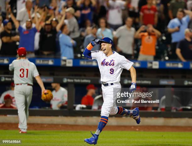 Brandon Nimmo of the New York Mets celebrates as he runs home after hitting a game winning walk off home run in the 10th inning in an MLB baseball...