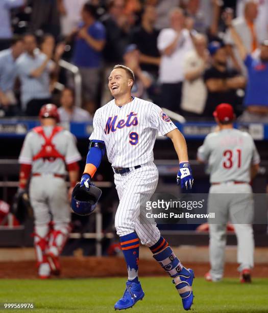 Brandon Nimmo of the New York Mets celebrates as he runs home after hitting a game winning walk off home run as losing pitcher Mark Leiter Jr. #31 of...