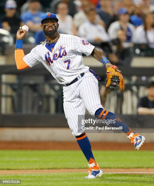 Jose Reyes of the New York Mets throws to first base in an MLB baseball game against the Philadelphia Phillies on July 11, 2018 at Citi Field in the...