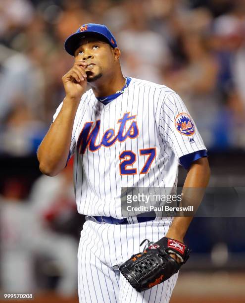 Pitcher Jeurys Familia of the New York Mets reacts as he walks off the field after pitching in the 9th inning in an MLB baseball game against the...