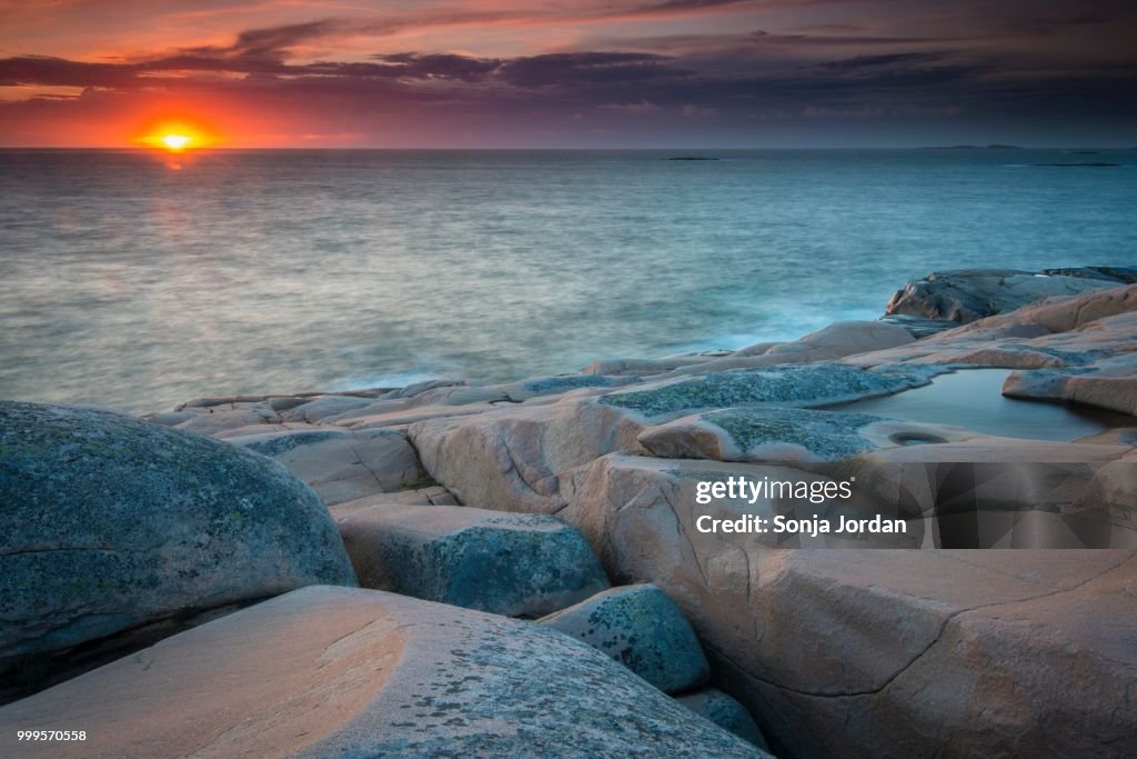 Rocks, sunset, evening atmosphere at the coastline near Smoegen, Bohuslaen province, Vaestra Goetaland County, Sweden