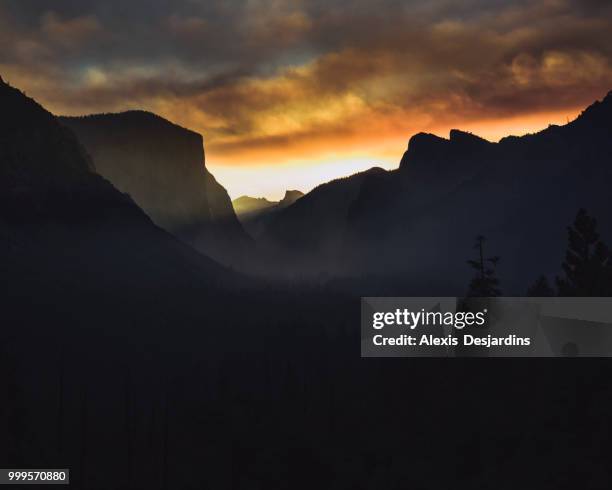 fiery sunrise over yosemite valley - alexis stock pictures, royalty-free photos & images