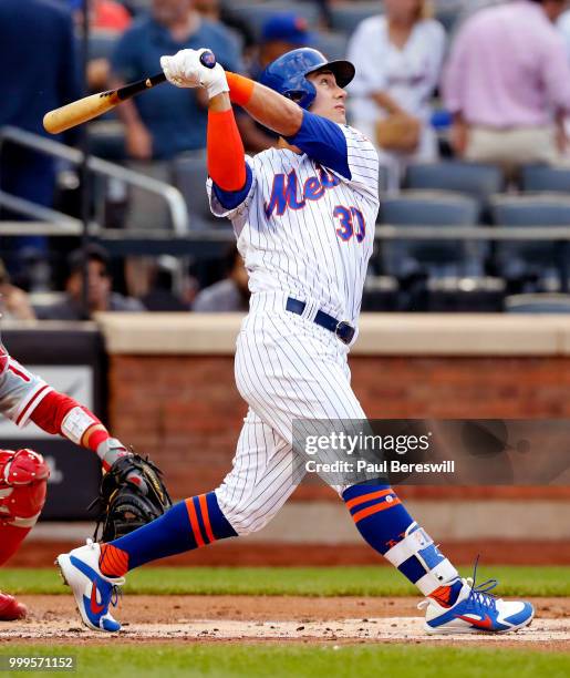 Michael Conforto of the New York Mets bats in an MLB baseball game against the Philadelphia Phillies on July 11, 2018 at Citi Field in the Queens...