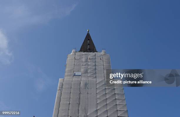 The town hall tower is barely visible behind the scaffolds in Kiel, Germany, 01 September 2017. The stonework will undergo elaborate reconstruction....