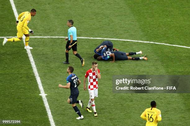 Djibril Sidibe and Paul Pogba of France celebrate victory following the 2018 FIFA World Cup Final between France and Croatia at Luzhniki Stadium on...