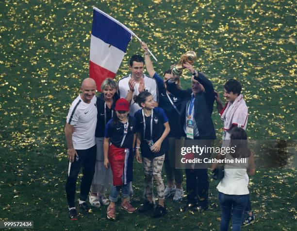 Didier Deschamps, Manager of France, Guy Stephan, France Assistant Coach, and France Goalkeeping Coach, Franck Raviot, celebrate with their families...