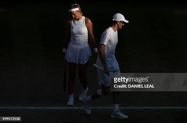 Britain's Jamie Murray and Belarus's Victoria Azarenka react after losing a game to Austria's Alexander Peya and US player Nicole Melichar in their...