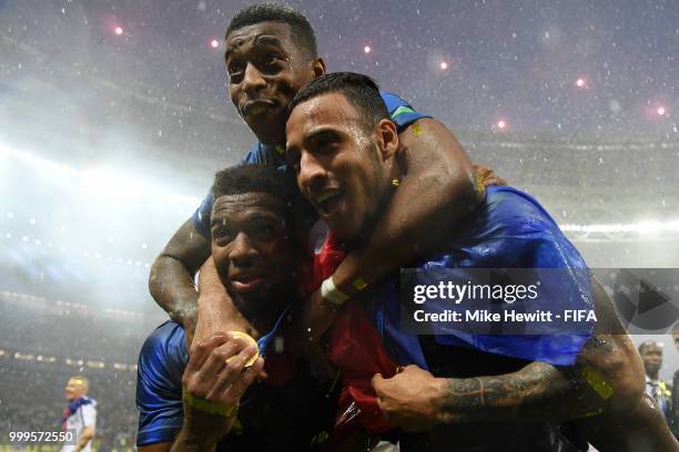 Presnel Kimpembe, Thomas Lemar, and Corentin Tolisso of France celebrate following their sides victory in the 2018 FIFA World Cup Final between...