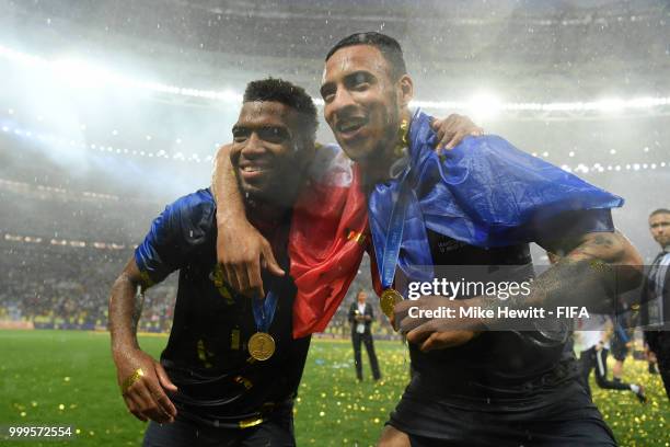 Thomas Lemar of France and Corentin Tolisso of France celebrate following their sides victory in the 2018 FIFA World Cup Final between France and...