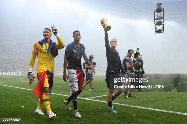 Antoine Griezmann of France celebrates with the World Cup Trophy following his sides victory in the 2018 FIFA World Cup Final between France and...