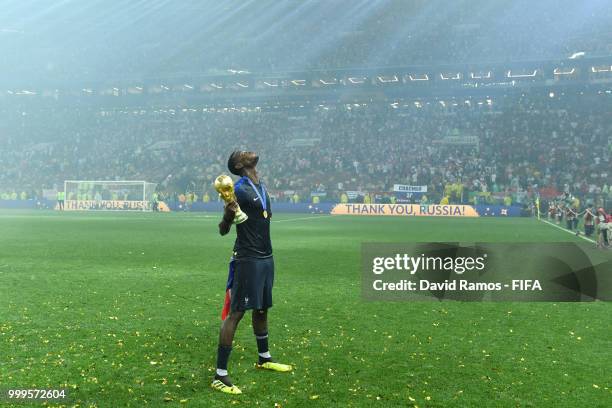 Paul Pogba of France celebrates with the World Cup Trophy following his sides victory in the 2018 FIFA World Cup Final between France and Croatia at...