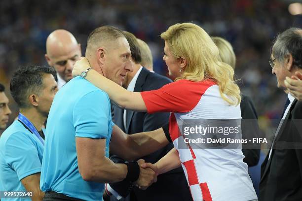 Referee Nestor Pitana shakes hands with President of Croatia, Kolinda Grabar Kitarovic during presentations after the 2018 FIFA World Cup Final...