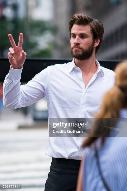 Liam Hemsworth is seen filming a scene for 'Isn't It Romantic?' in Midtown on July 15, 2018 in New York City.