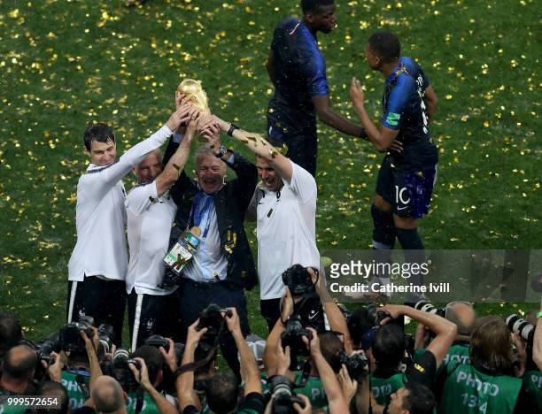 Didier Deschamps, Manager of France and hisi staff celebrate with the World Cup Trophy following their sides victory in the 2018 FIFA World Cup Final...