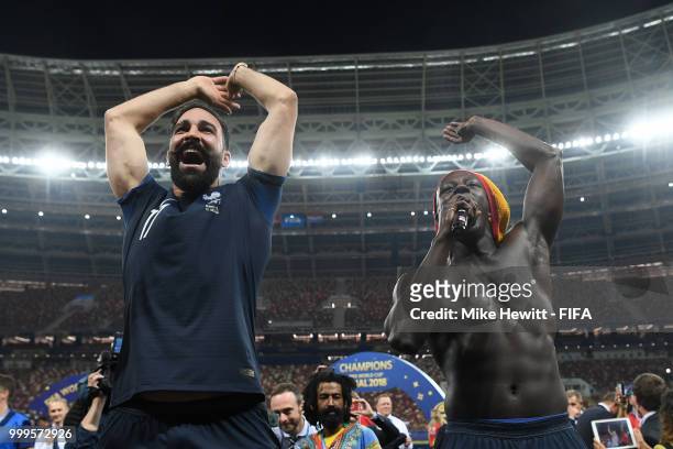 Adil Rami and Benjamin Mendy of France celebrate following their sides victory in the 2018 FIFA World Cup Final between France and Croatia at...