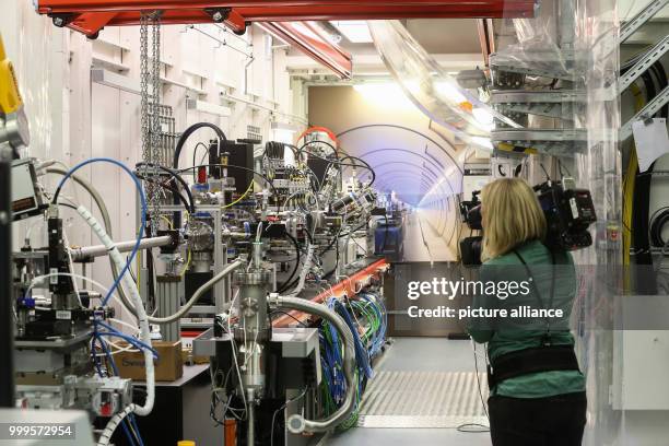 Woman is shooting with a camera into the so called "experimental hut" of the European XFEL in Schenefeld, Germany, 01 September 2017. The facility...