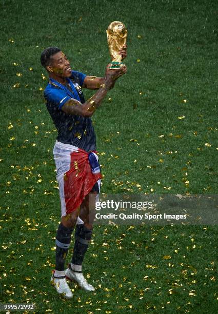 Presnel Kimpembe of France celebrates with the trophy after the 2018 FIFA World Cup Russia Final between France and Croatia at Luzhniki Stadium on...