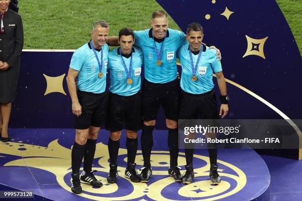 Fourth official Bjorn Kuipers, Assistant referee Juan Pablo Belatti, Referee Nestor Pitana, Assistant referee Hernan Maidana pose with medals, for...