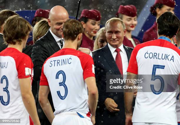 President Gianni Infantino and President of Russia Vladimir Putin hand out runners up medals to Croatia players following the 2018 FIFA World Cup...