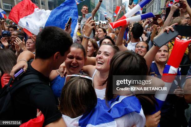 French fans react after France won the World Cup final match between France vs Croatia on July 15, 2018 in New York. - The World Cup final between...