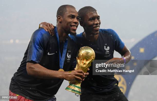 Djibril Sidibe of France celebrates victory with the World Cup trophy during the 2018 FIFA World Cup Final between France and Croatia at Luzhniki...