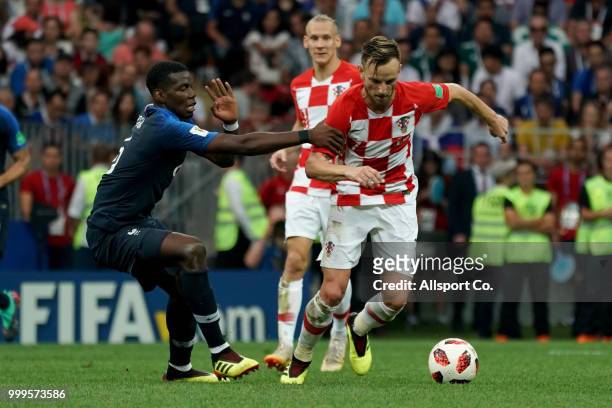 Paul Pogba of France competes for the ball with Ivan Rakitic of Croatia during the 2018 FIFA World Cup Russia Final between France and Croatia at...