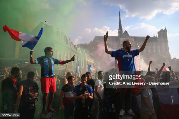 Supporters of France celebrate on the in front of Amiens Cathedral after watching their team win the 2018 FIFA World Cup Final in Russia after the...
