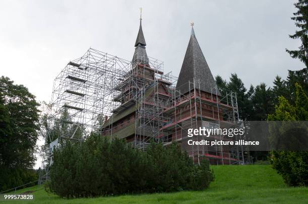 Scaffolds have been installed around te stave church Gustav-Adolf in Hahnenklee, Germany, 17 August 2017. Photo: Swen Pförtner/dpa