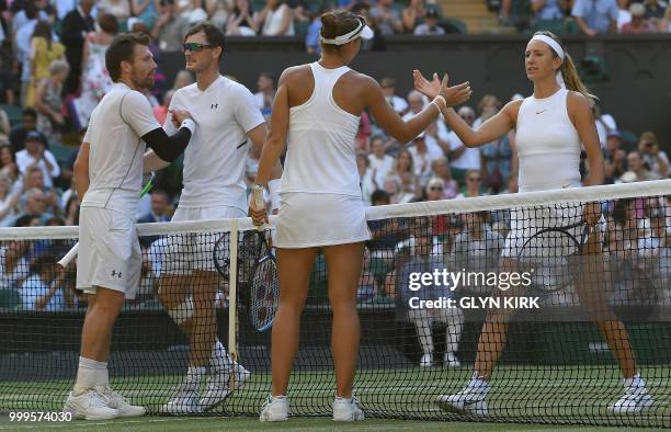 Austria's Alexander Peya and US player Nicole Melichar shake hands after beating Britain's Jamie Murray and Belarus's Victoria Azarenka 7-6, 6-3 in...