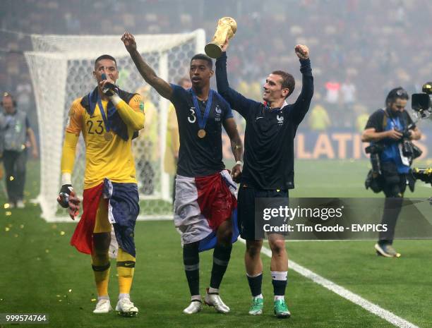 France goalkeeper Alphonse Areola , Presnel Kimpembe and Antoine Griezmann celebrate after the FIFA World Cup 2018 final at the Luzhniki Stadium in...