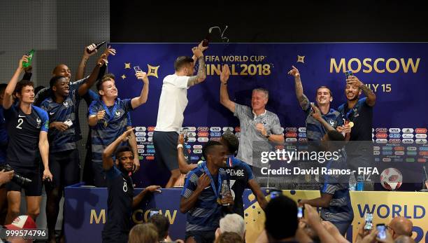 France players celebrate with Didier Deschamps, Manager of France during the press conference after the 2018 FIFA World Cup Final between France and...