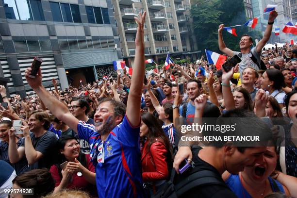 French fans react after France won the World Cup final match between France vs Croatia on July 15, 2018 in New York. - The World Cup final between...