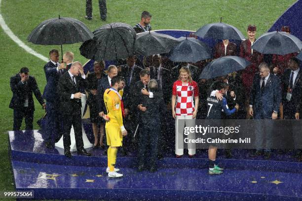 Hugo Lloris, Didier Deschamps and Antoine Griezmann of France receive their World Cup Winner's medals following the 2018 FIFA World Cup Final between...