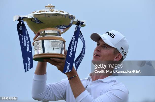 Brandon Stone of Republic of South Africa poses with the Scottish Open trophy after winning the tournament and qualifying for the Open at Carnoustie...