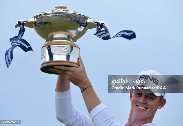 Brandon Stone of Republic of South Africa poses with the Scottish Open trophy after winning the tournament and qualifying for the Open at Carnoustie...